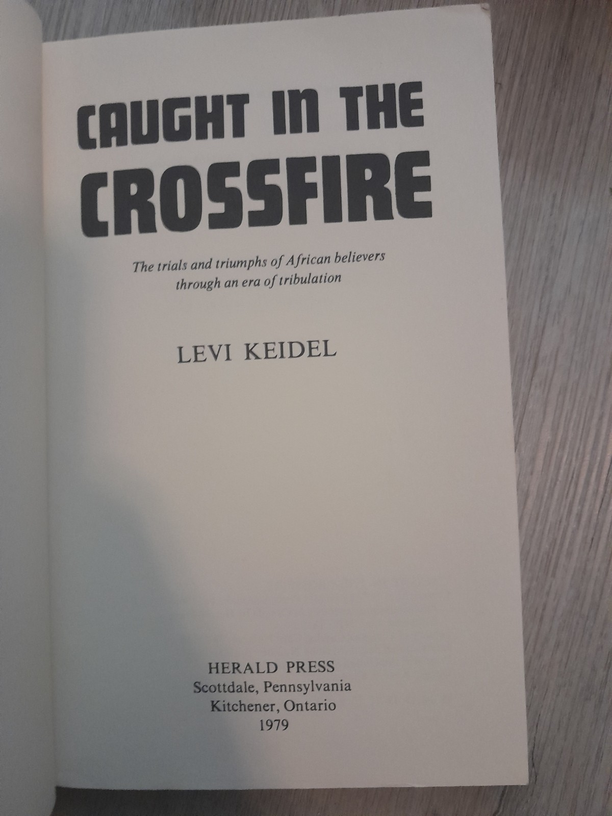 1979 Herald Press Caught in the Crossfire Levi Keidel 1st Edition Paperback