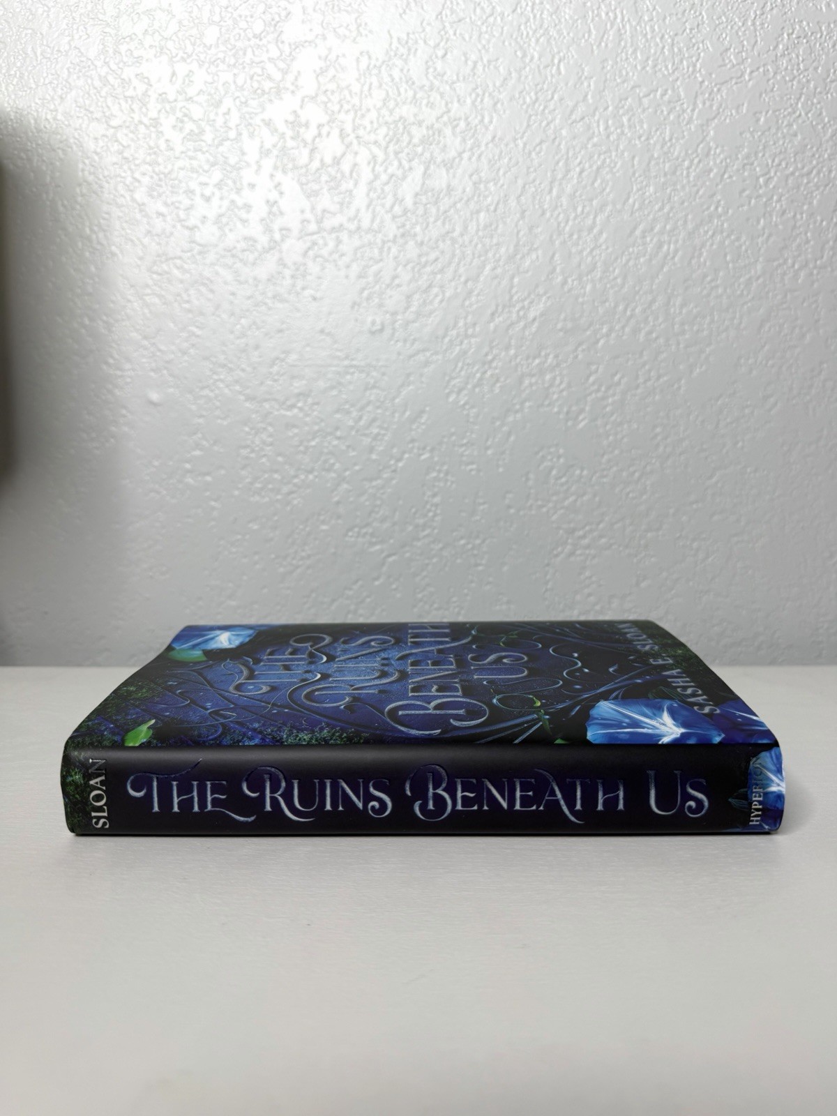The Ruins Beneath Us by Sasha E. Sloan – Sprayed Edges – Hardcover – NEW