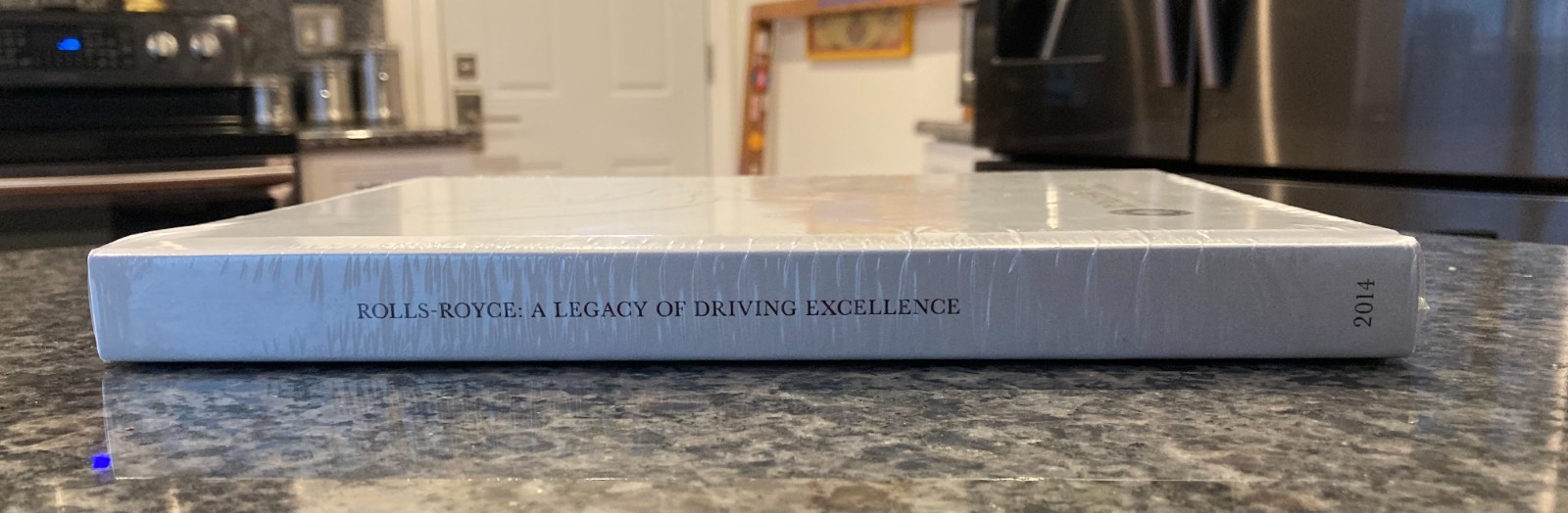 ROLLS-ROYCE FACTORY SEALED 2014 HARDBOUND BOOK A LEGACY OF DRIVING EXCELLENCE.