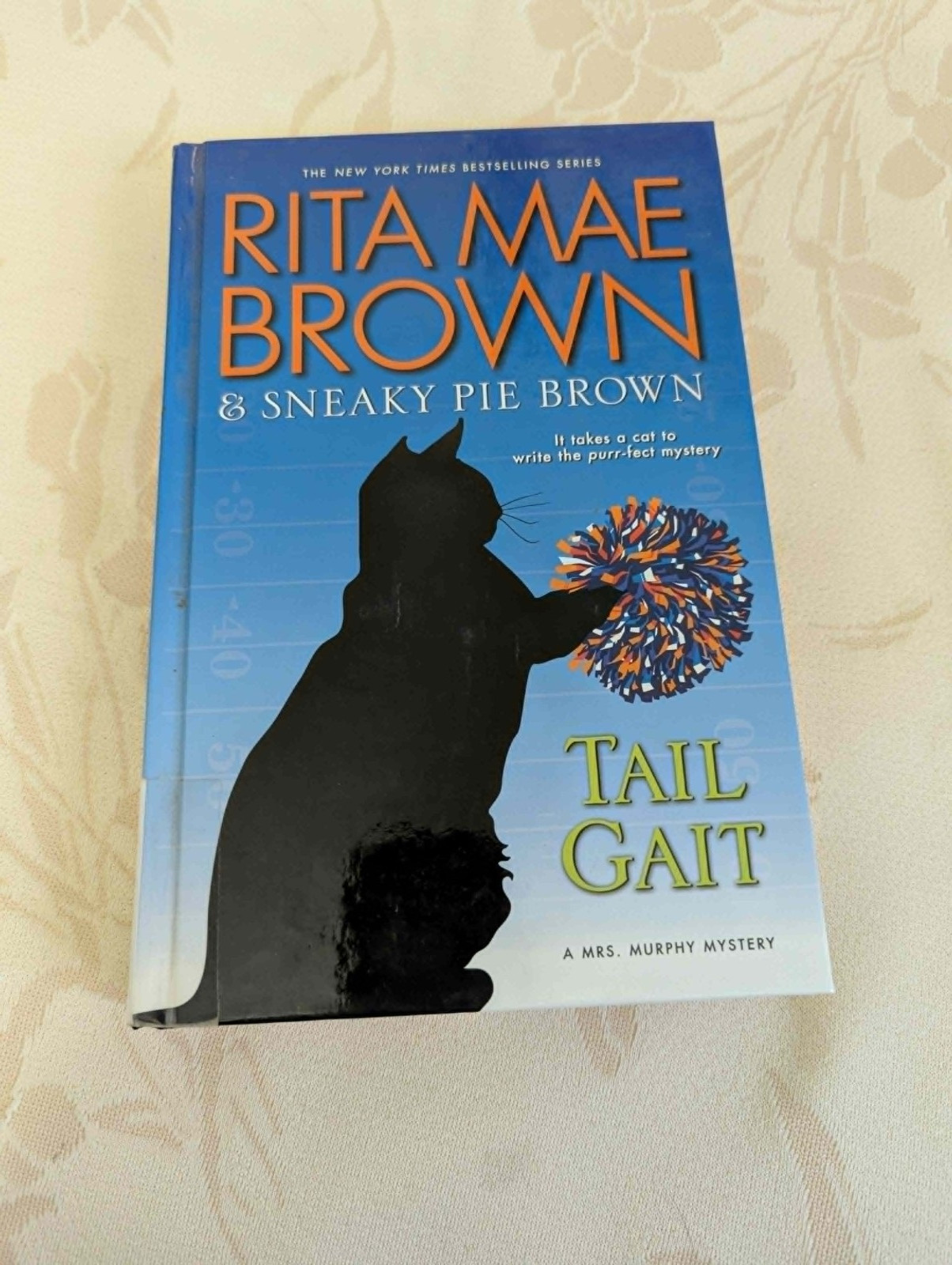 4 “The Cat Who” books by Lilian Jackson Braun, 1 by Rita Mae Brown (“Tail Gait”)