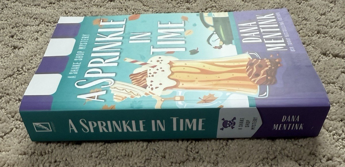 A Sprinkle in Time Shake Shop Mystery Paperback Novel by Dana Mentink New