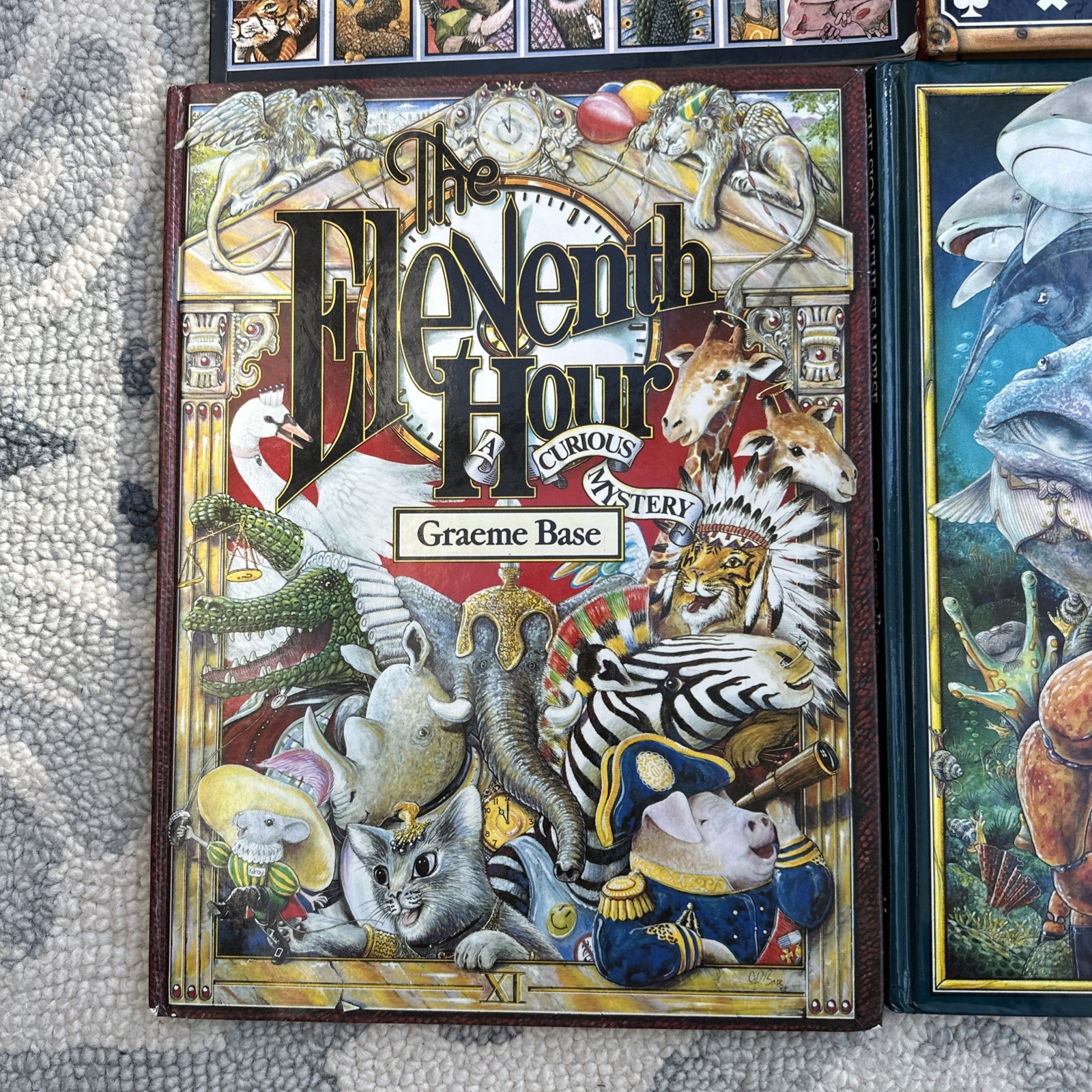 Lot of 4 Graeme Base Books Animalia Enigma Seahorse Eleventh Hour