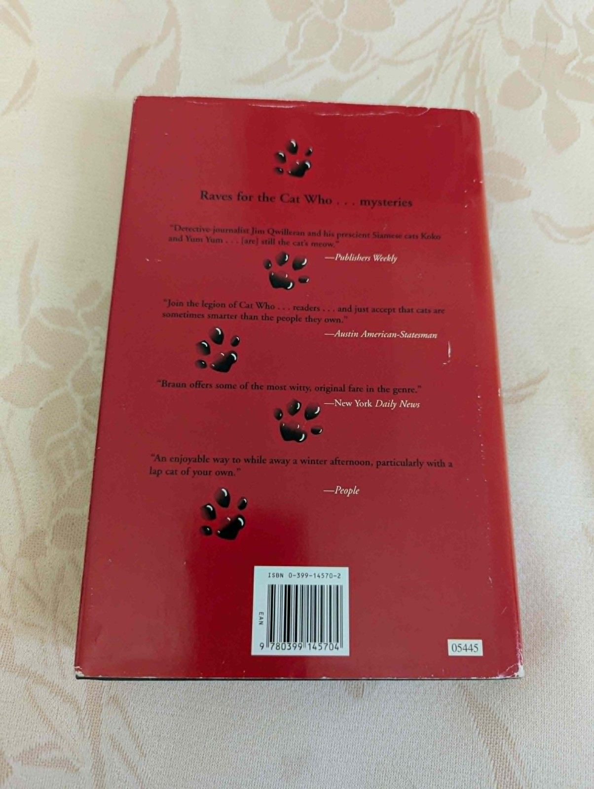4 “The Cat Who” books by Lilian Jackson Braun, 1 by Rita Mae Brown (“Tail Gait”)