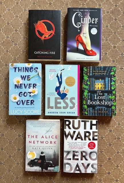 Lot of 7 Popular Books – Lucy Score, Kate Quinn, Suzanne Collins – gently used