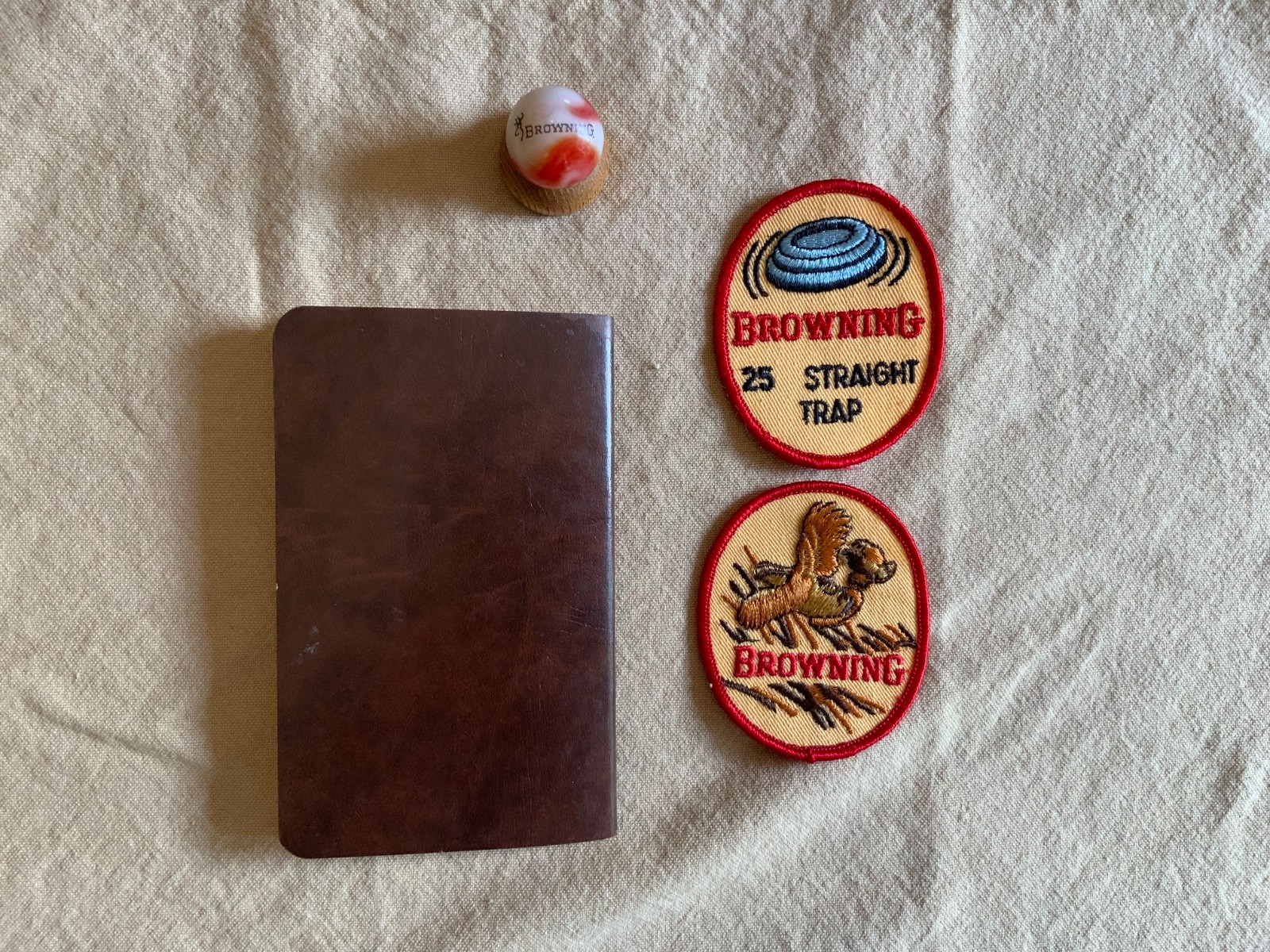 Browning Firearms collectibles -Browning signed book, 2 Patches, Marble&holder