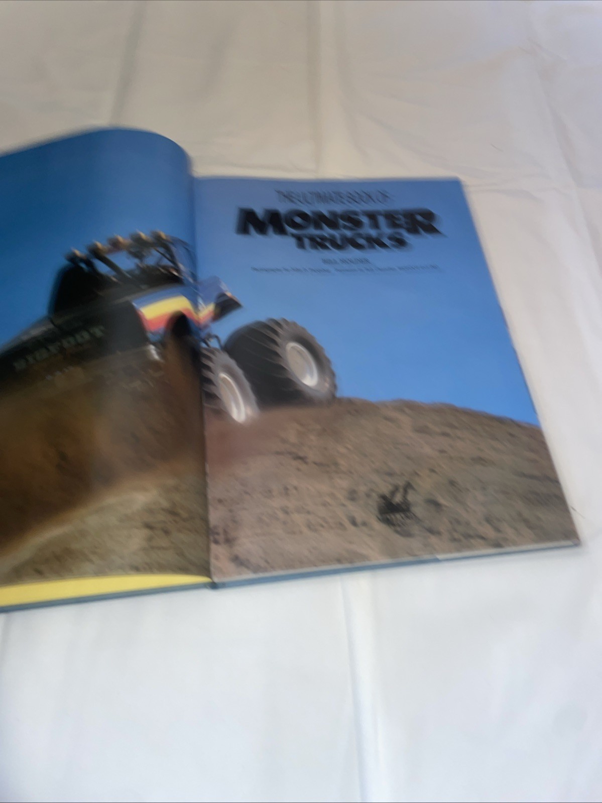 ULTIMATE BOOK OF MONSTER TRUCKS By Bill Holder – As Is Damage Bigfoot Ford 1990