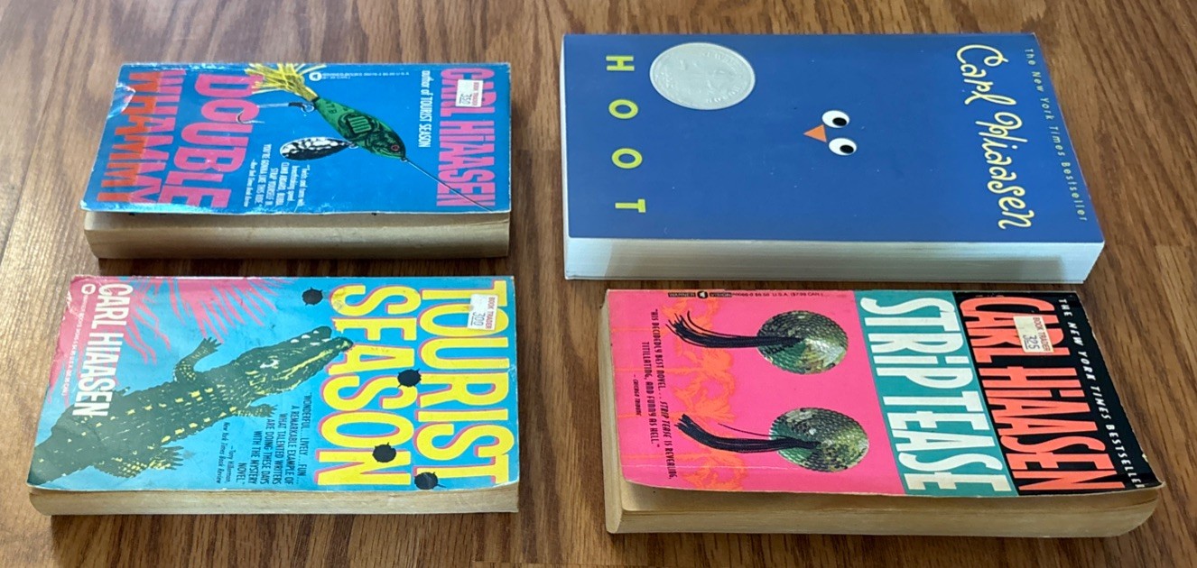 Set of 4 Paperbacks by Carl Hiaasen – Tourist Season, Hoot, Strip Tease, Double