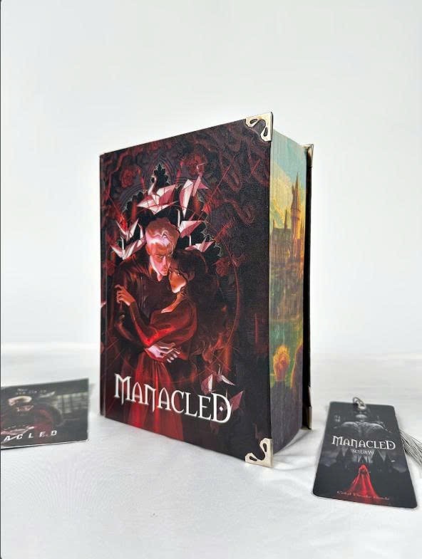 Limited edition hardcover Manacled book with 3 sided color spray bookmark card