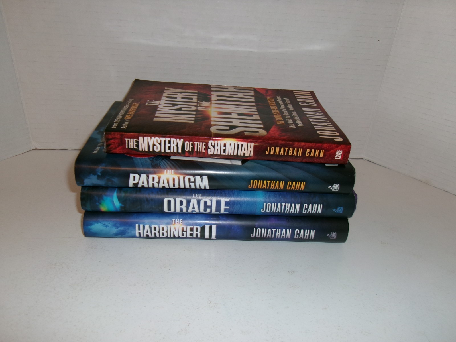 4 books by Jonathan Cahn, The Oracle, The Paradigm, the Harbinger II
