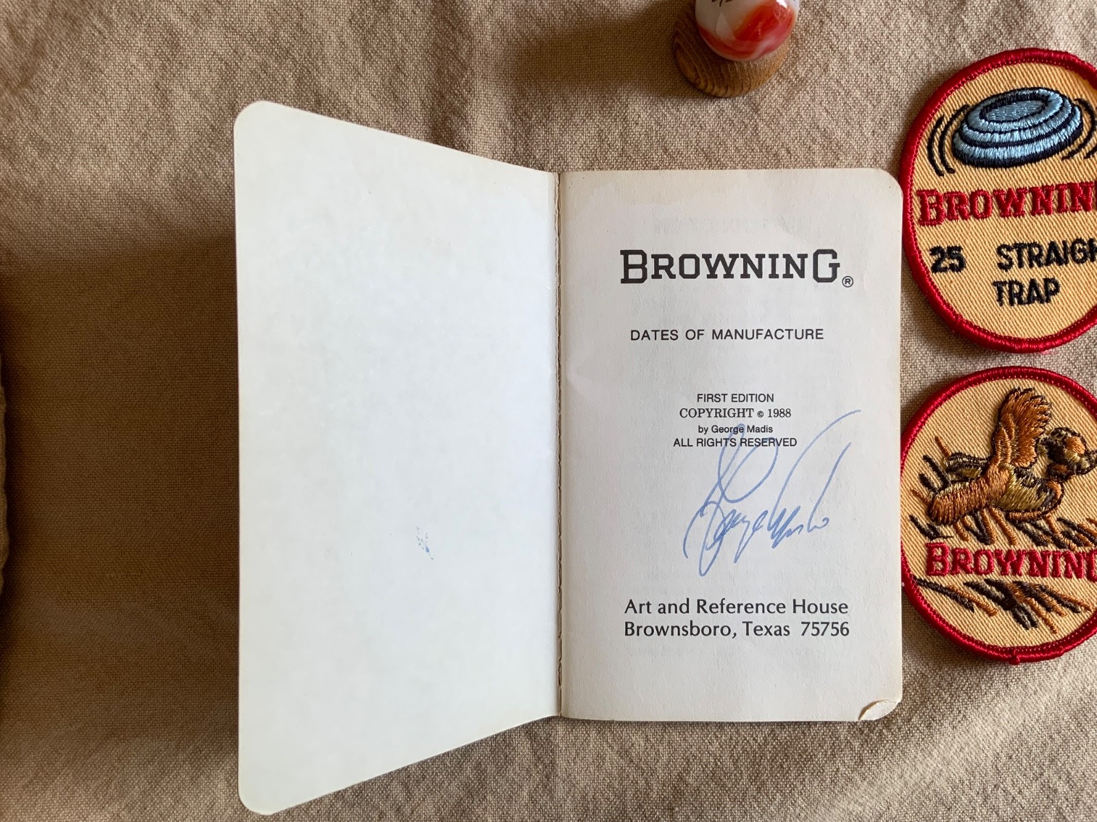 Browning Firearms collectibles -Browning signed book, 2 Patches, Marble&holder