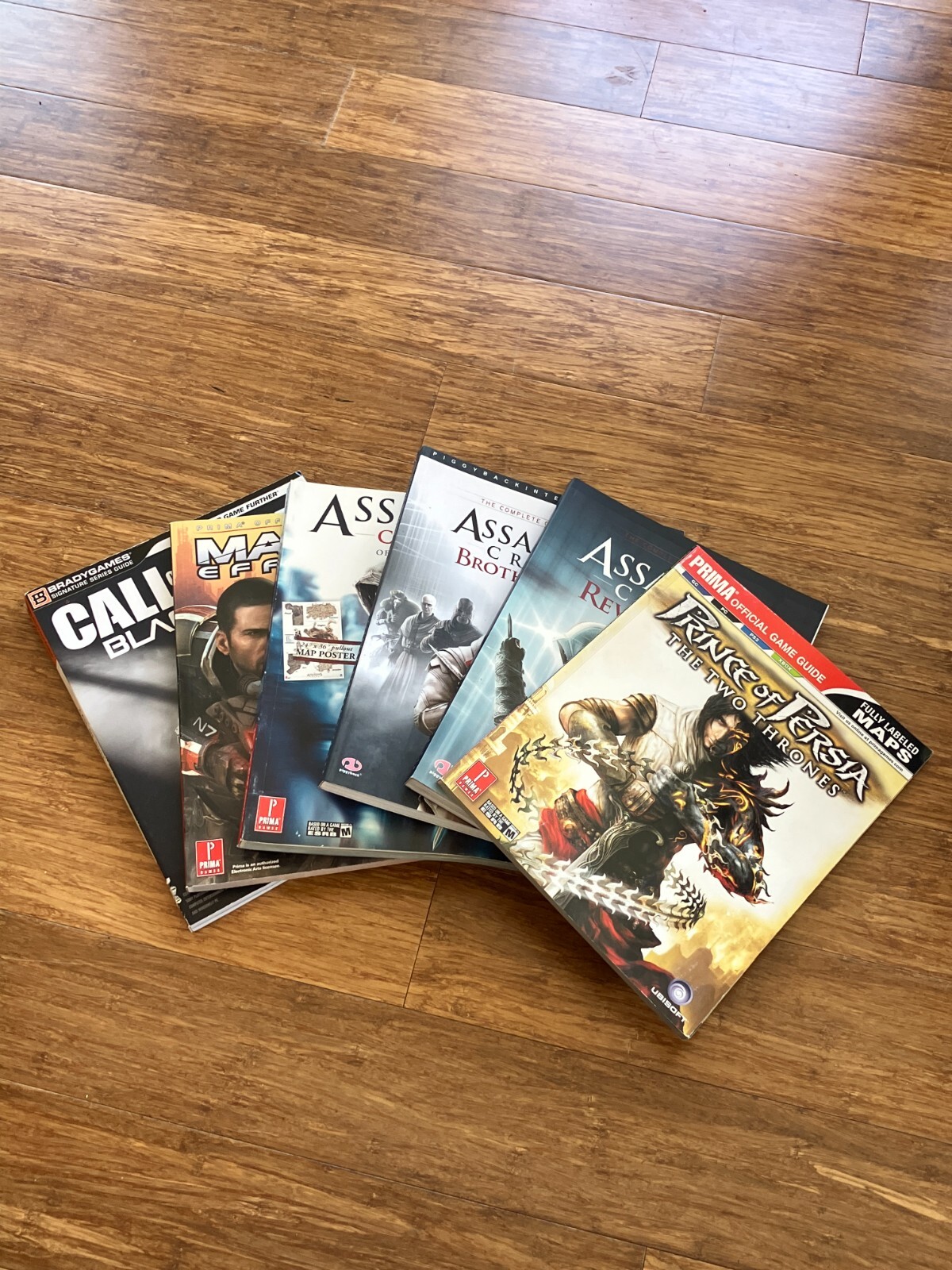 BradyGames & Prima Lot 6 Game Guides Mass Effect 2, Black Ops, Assassins Creed