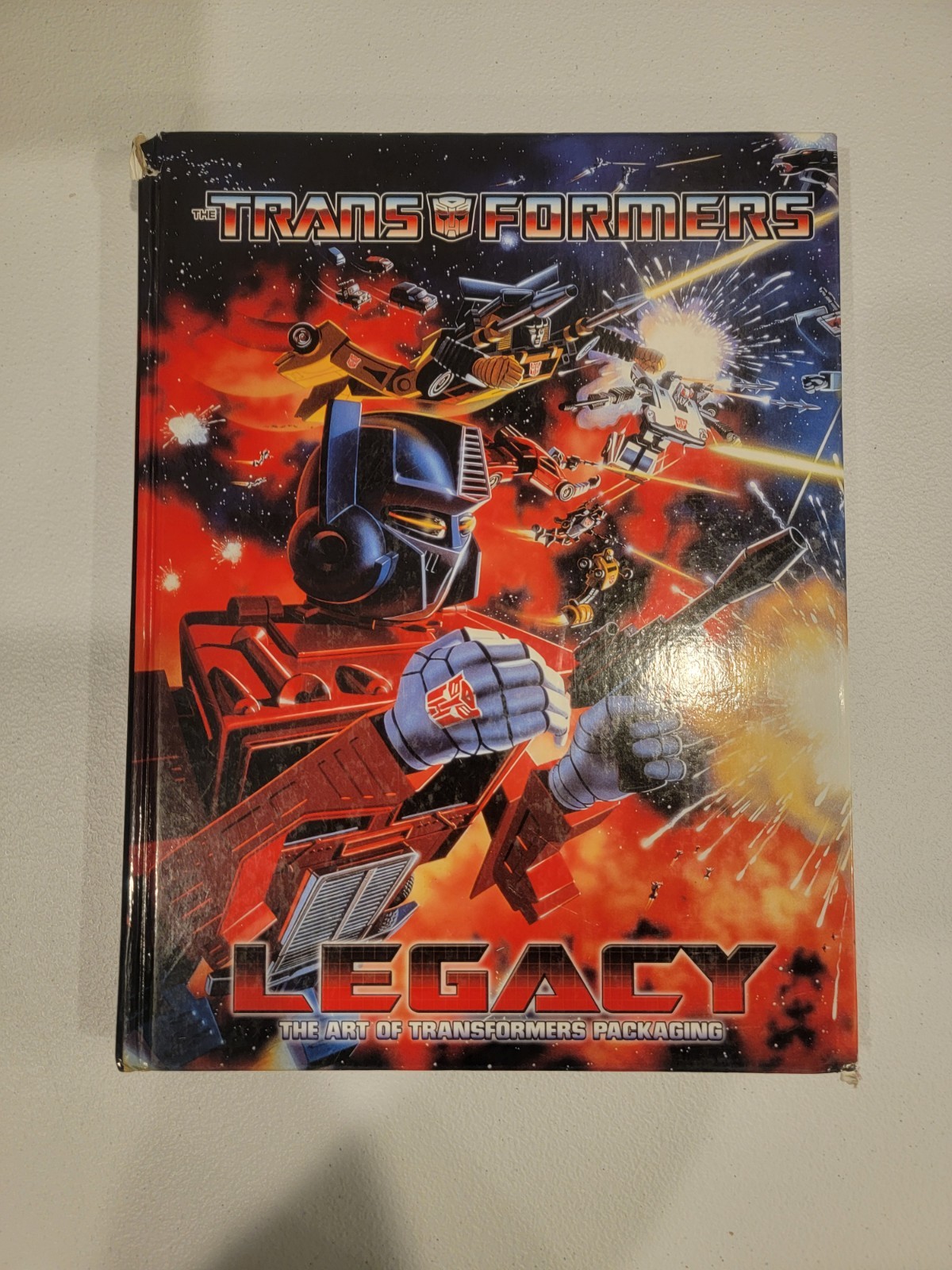 Transformers Legacy Book: The Art of Transformers Packaging + Visual Guide Book