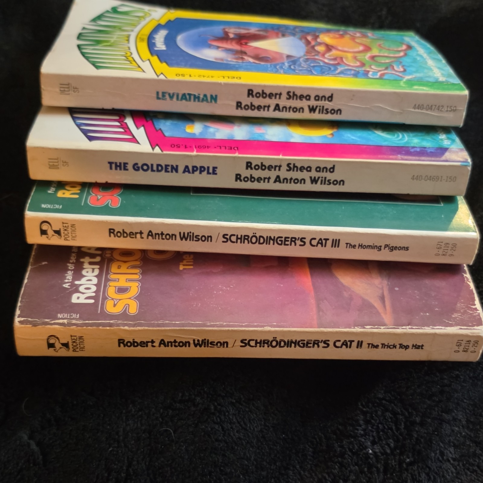 Robert Anton Wilson Lot: Illuminatus! Parts 2 & 3 + Schrödinger’s Cat II & III