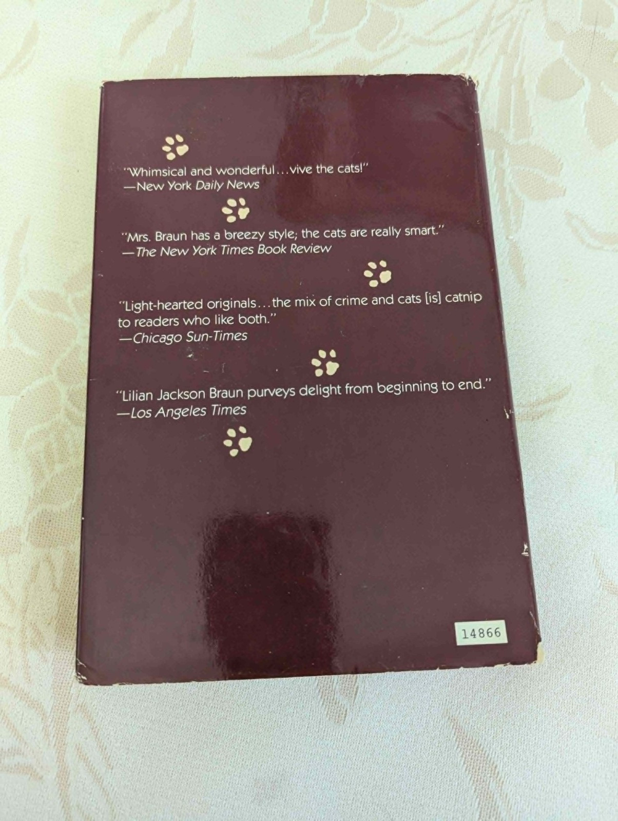 4 “The Cat Who” books by Lilian Jackson Braun, 1 by Rita Mae Brown (“Tail Gait”)