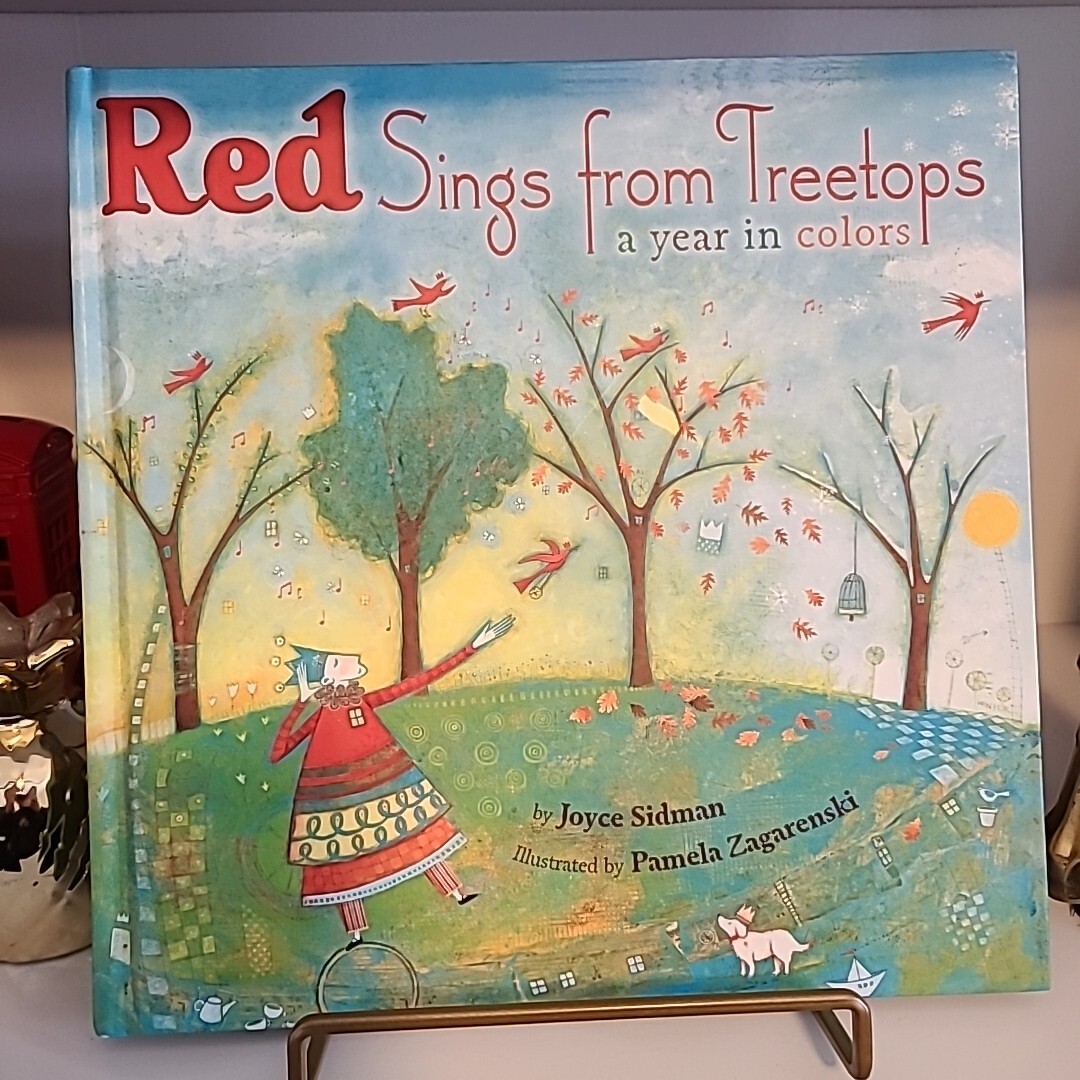 Red Sings from Treetops: A Caldecott Honor Award Winner by Joyce Sidman (2009)