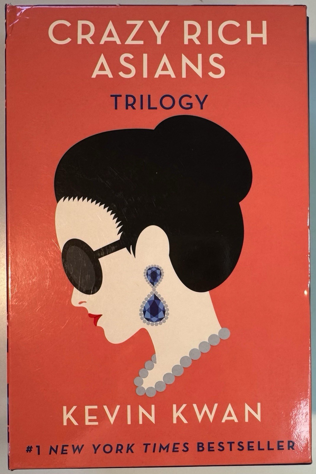 Paperback book box set titled ‘Crazy Rich Asians Trilogy’ by Kevin Kwan.