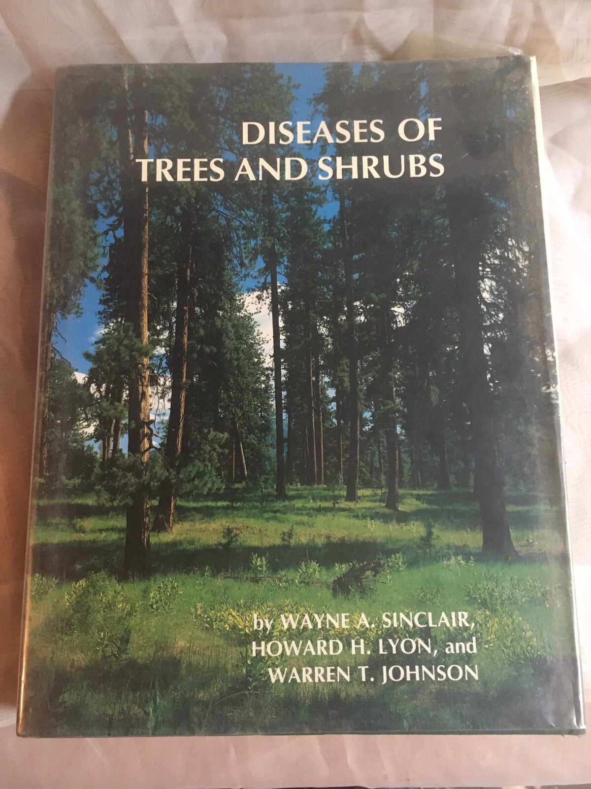 Diseases of Trees and Shrubs by Sinclair, Lyon, and Johnson (Cornell, 1987)