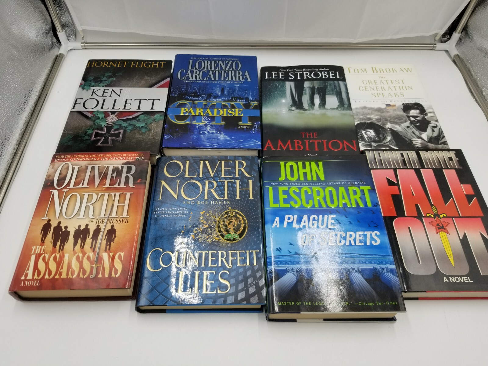 Lot of 8 Books Oliver North Ken Follet & more. See pictures