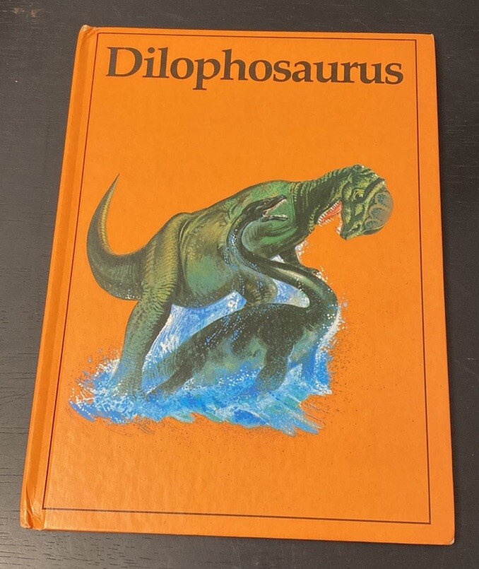 Vintage Rourke Dinosaur Library 7 Books Yellow Orange Peach Decorative Bookshelf