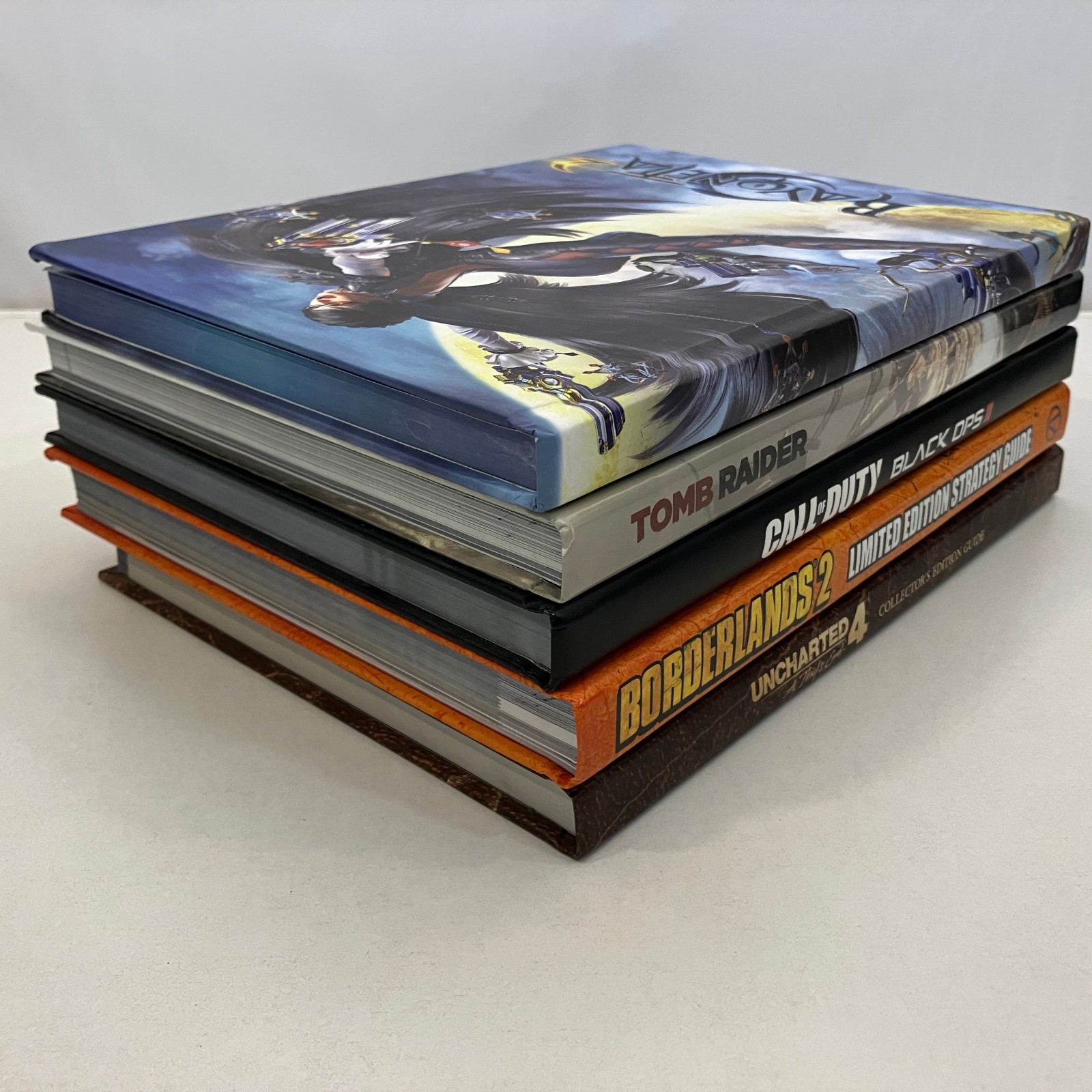 5 Misc Video Game Hardcover Guides Various Editions Lot Bayonetta Uncharted VGC