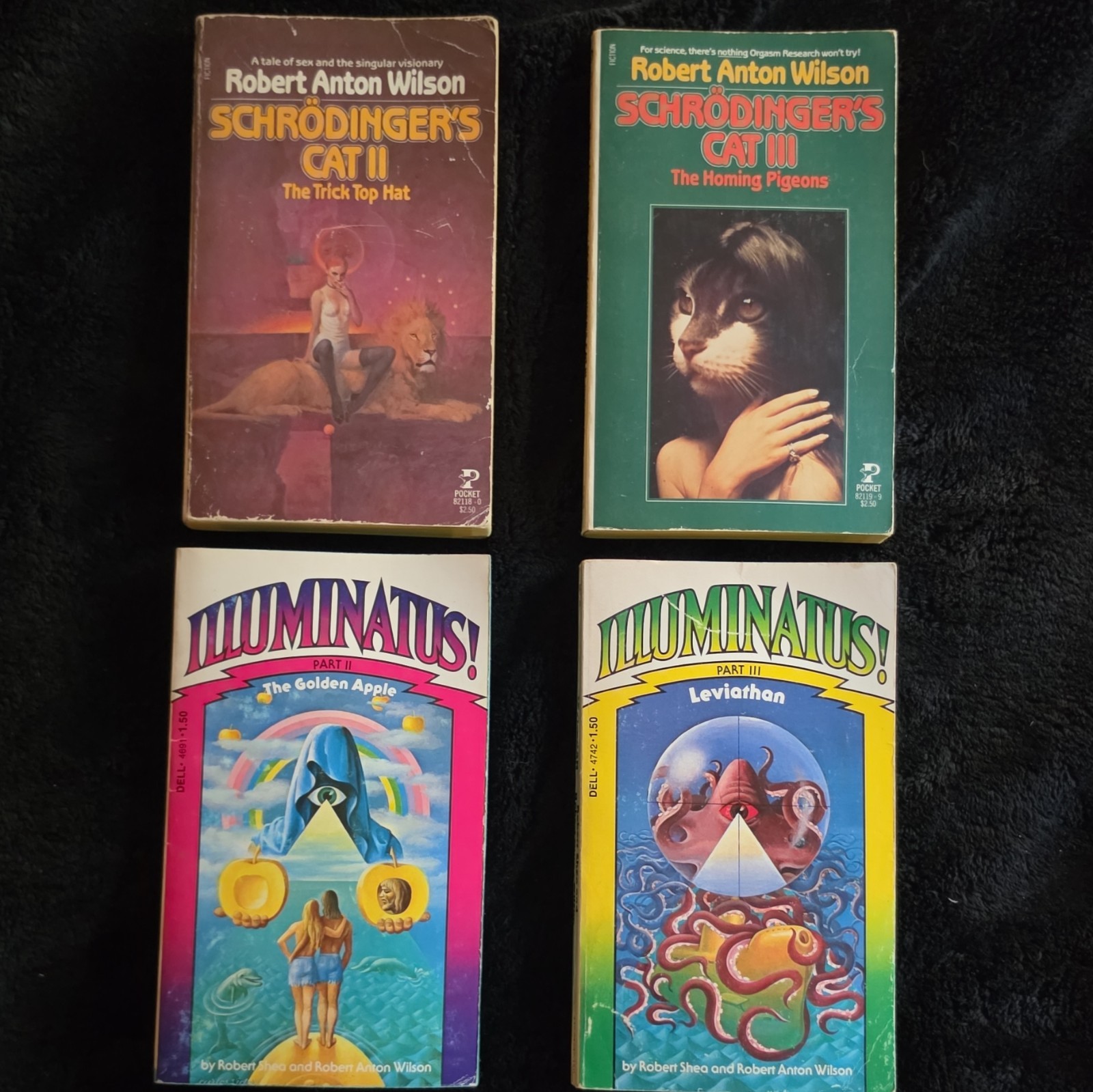Robert Anton Wilson Lot: Illuminatus! Parts 2 & 3 + Schrödinger’s Cat II & III