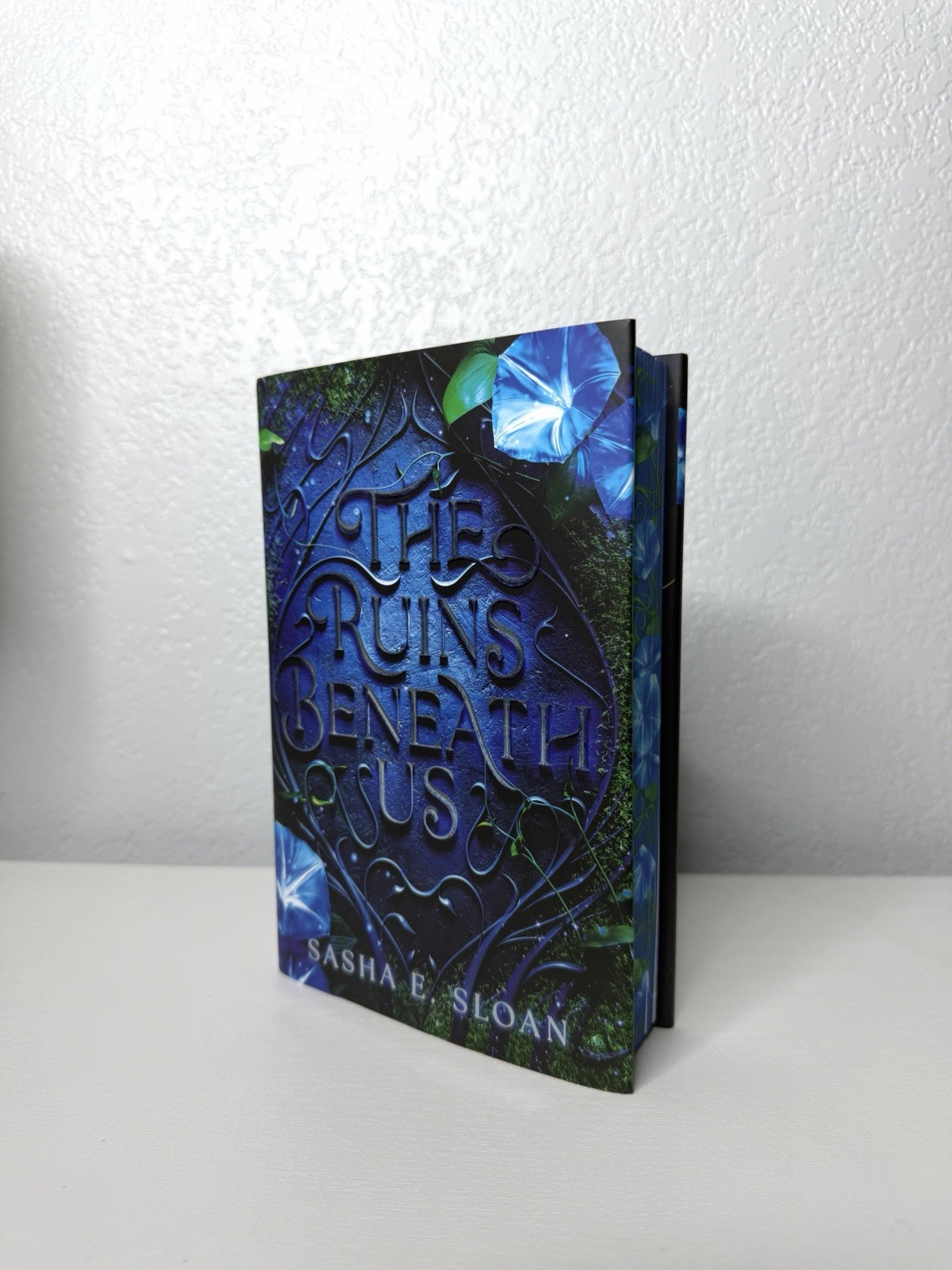 The Ruins Beneath Us by Sasha E. Sloan – Sprayed Edges – Hardcover – NEW