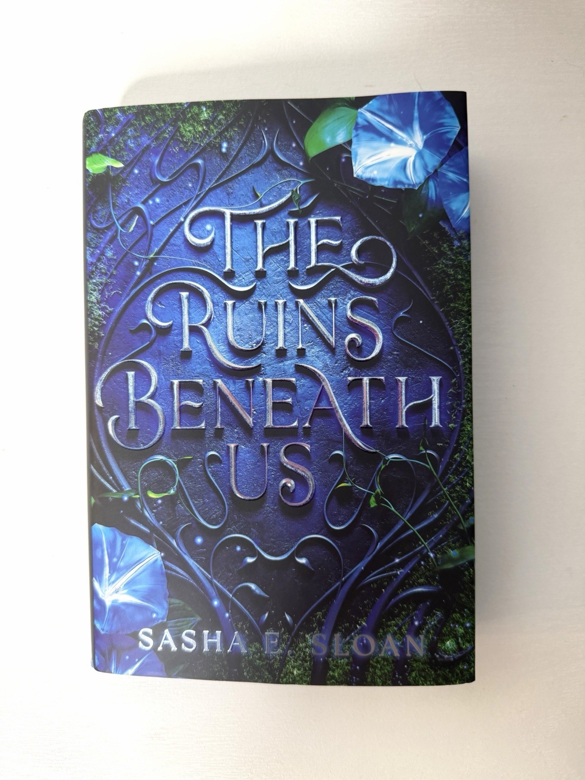 The Ruins Beneath Us by Sasha E. Sloan – Sprayed Edges – Hardcover – NEW