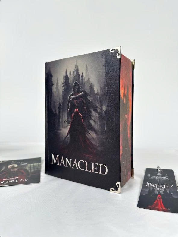 Limited edition hardcover Manacled book with 3 sided color spray bookmark card