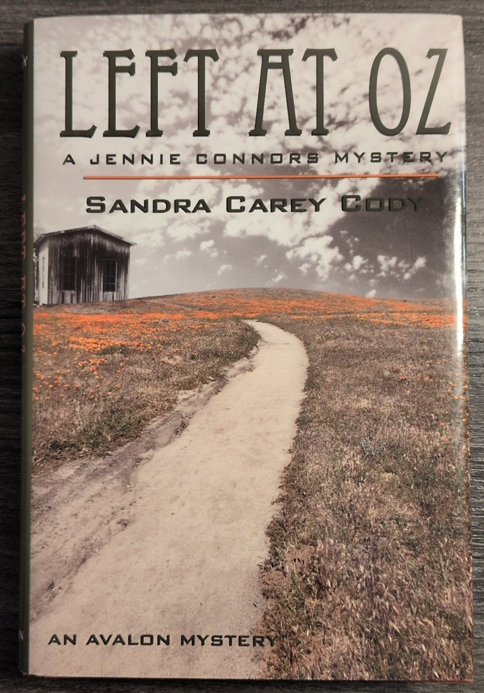 An Avalon Myuster 2 book bundle: Put Out the Light & Left At Oz – Signed HC