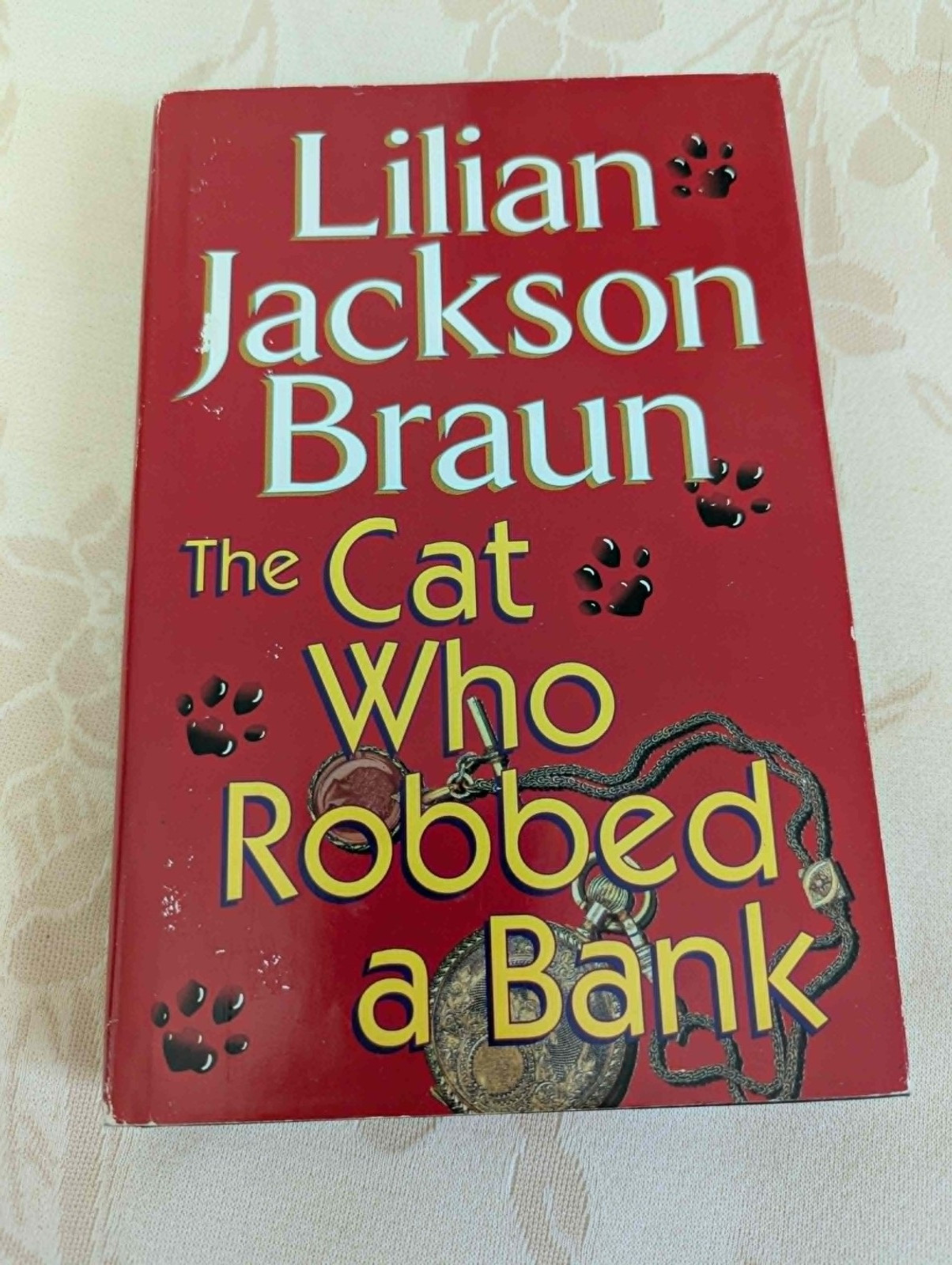 4 “The Cat Who” books by Lilian Jackson Braun, 1 by Rita Mae Brown (“Tail Gait”)