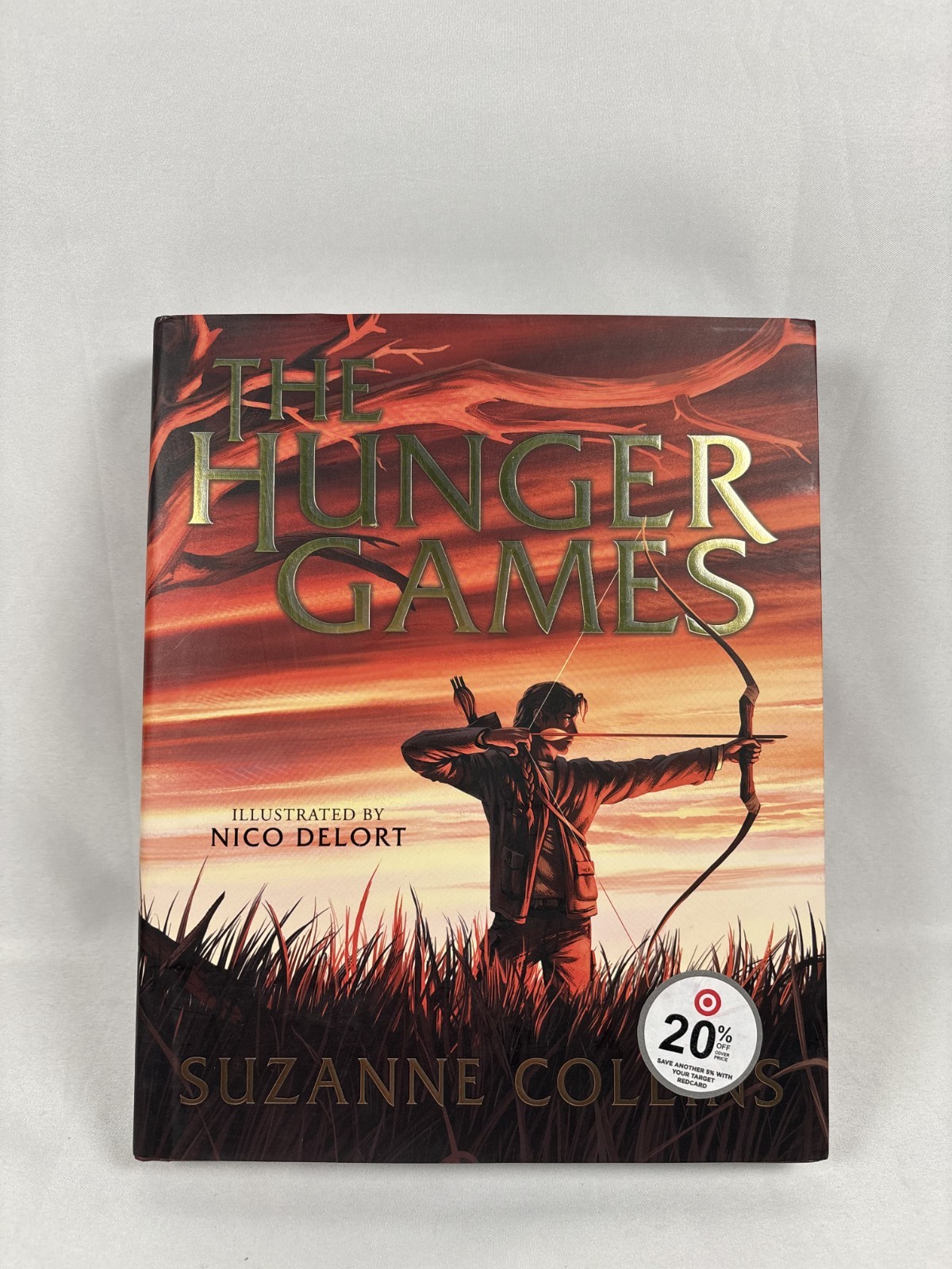 Hardcover The Hunger Games: Illustrated Edition By Suzanne Collins & Nico Delort