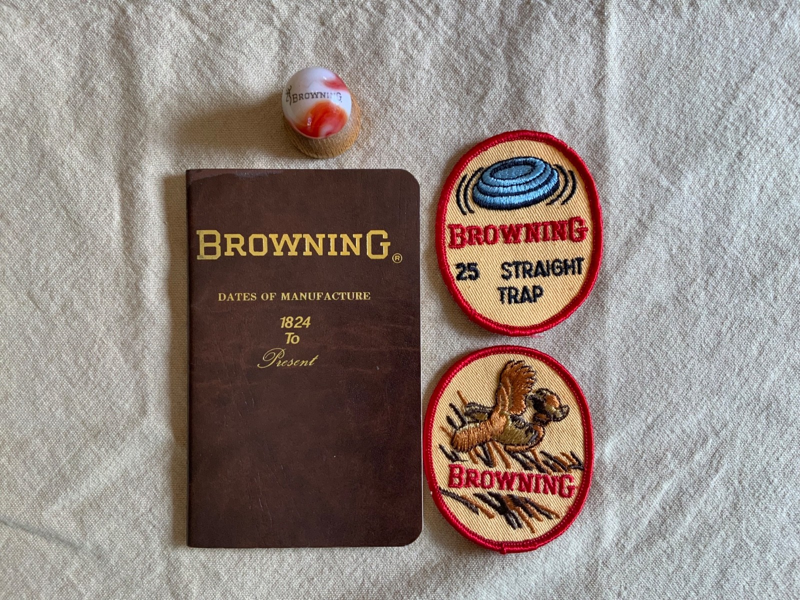 Browning Firearms collectibles -Browning signed book, 2 Patches, Marble&holder