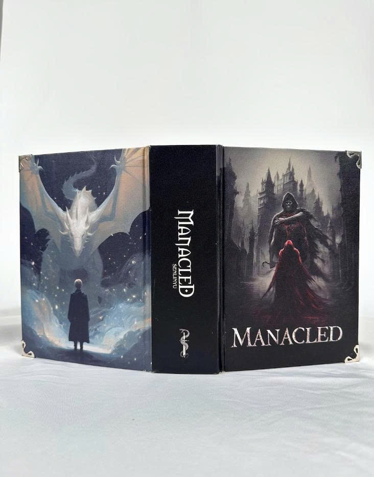 Limited edition hardcover Manacled book with 3 sided color spray bookmark card