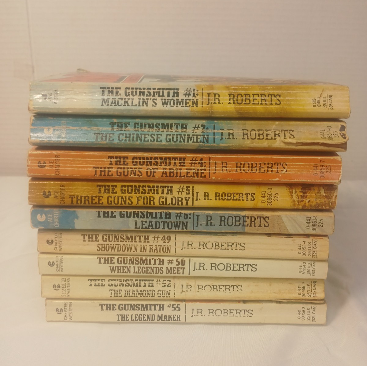 Lo of 9 The Gunsmith – J. R. Robert – Books 1-2, 4-6, 49 ,50, 52, and 55