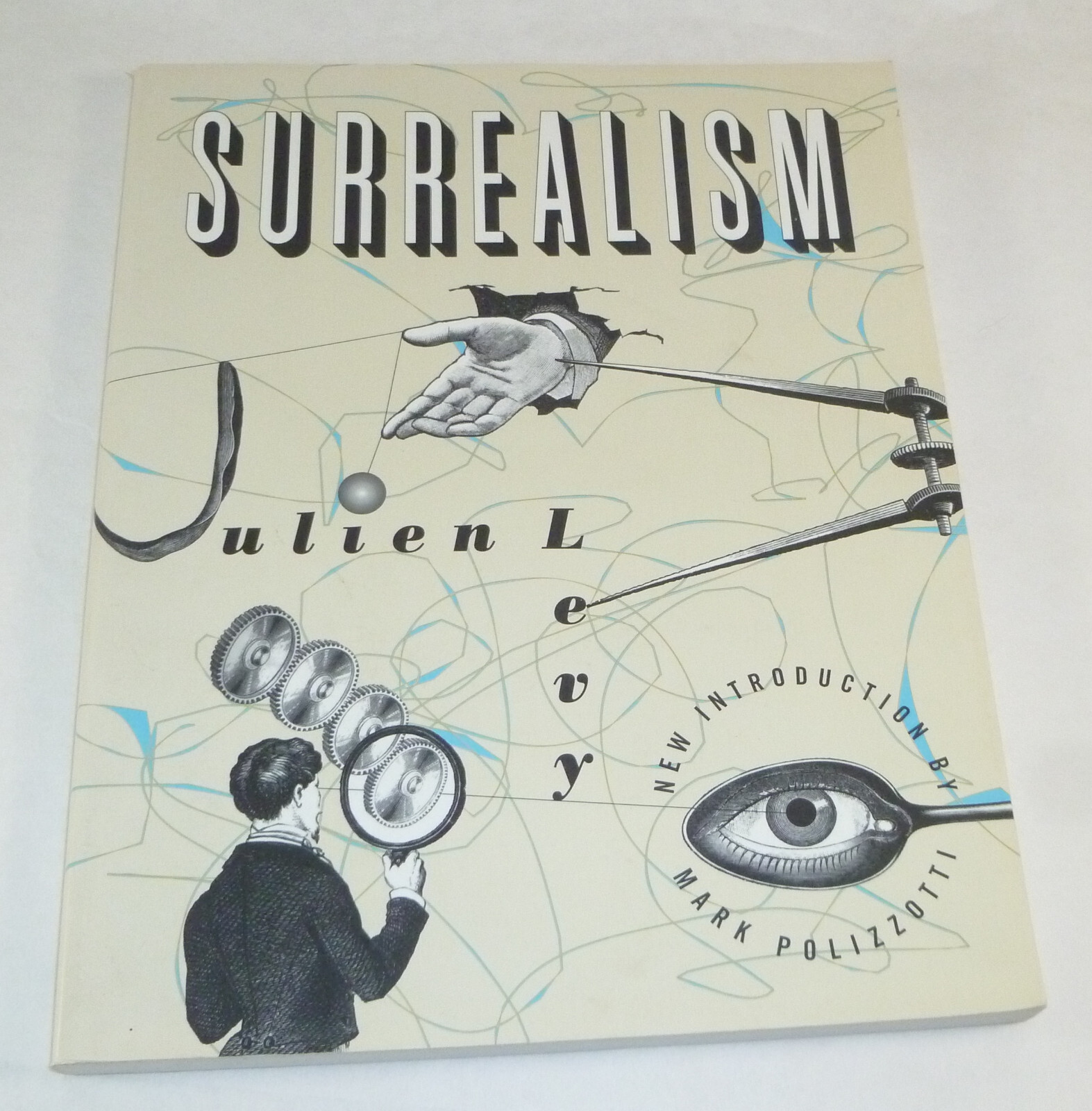 Surrealism by Julien Levy (1995) Trade Paperback – Breton / Duchamp / Eluard