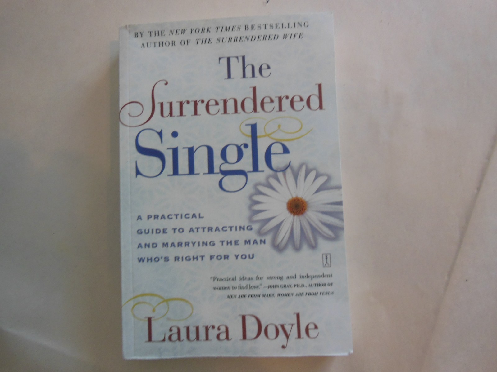 Surrendered Single : A Practical Guide to Attracting and Marrying the Man Who’s