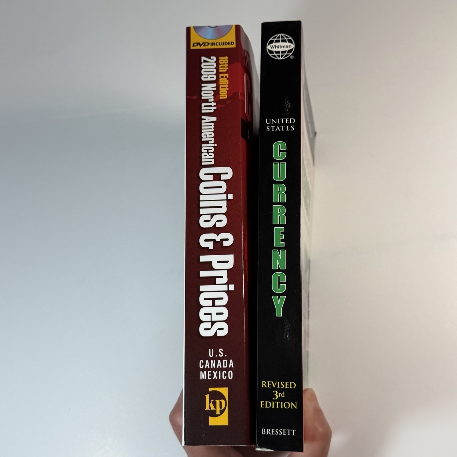 2 paperback books on coins and currency 2006 2009 Whitman Krause Publications