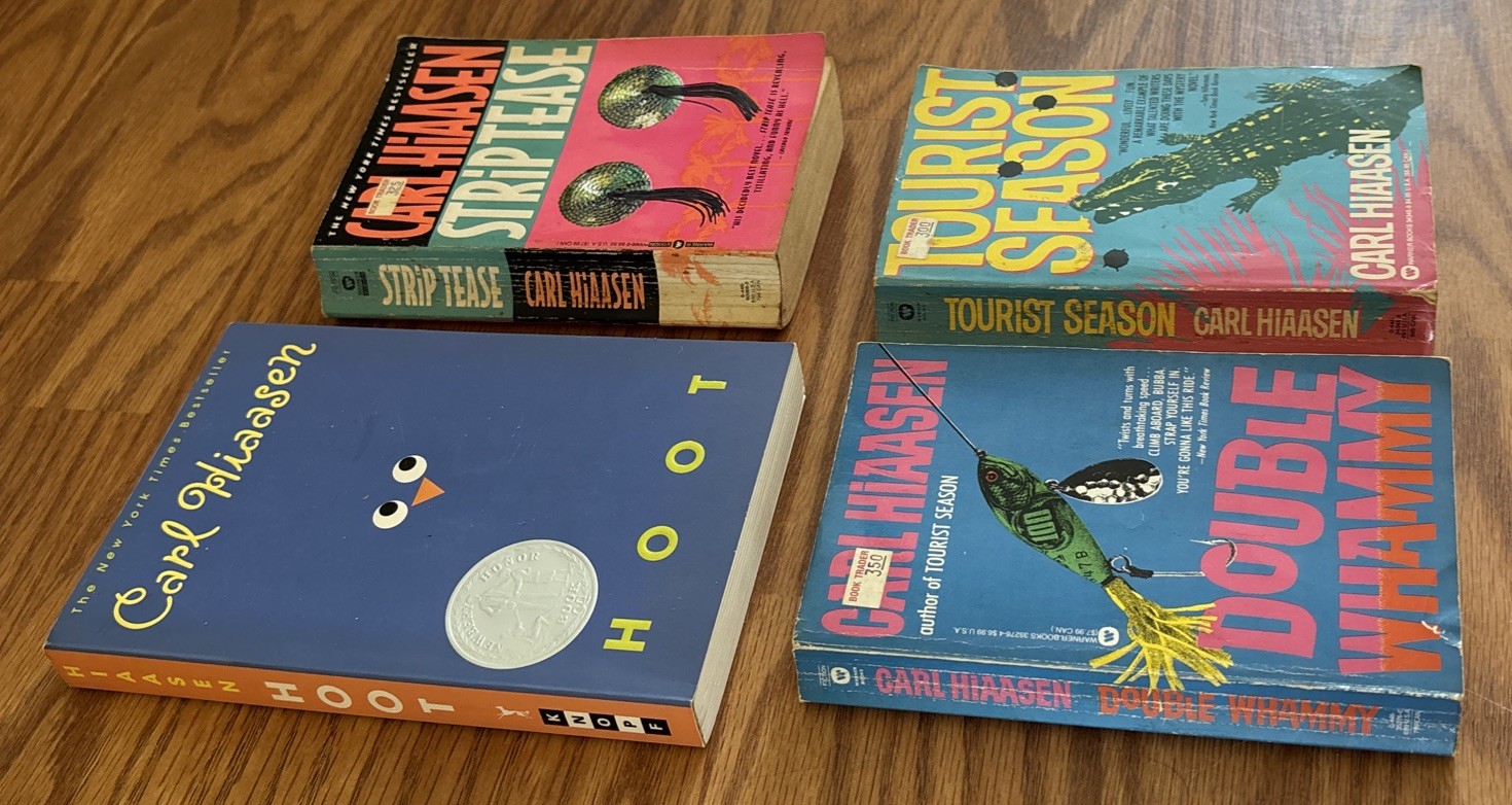 Set of 4 Paperbacks by Carl Hiaasen – Tourist Season, Hoot, Strip Tease, Double