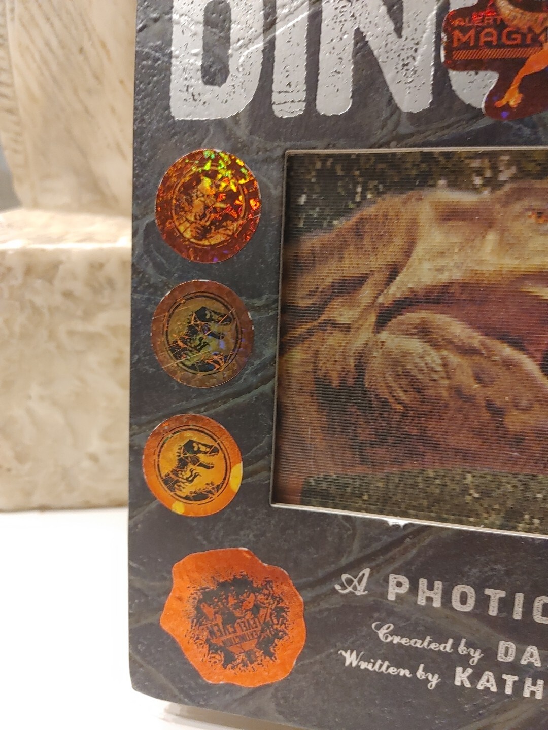 Dinosaur: A Photicular Book by Wollard, Dinosaur Stickers On Cover Of Book.