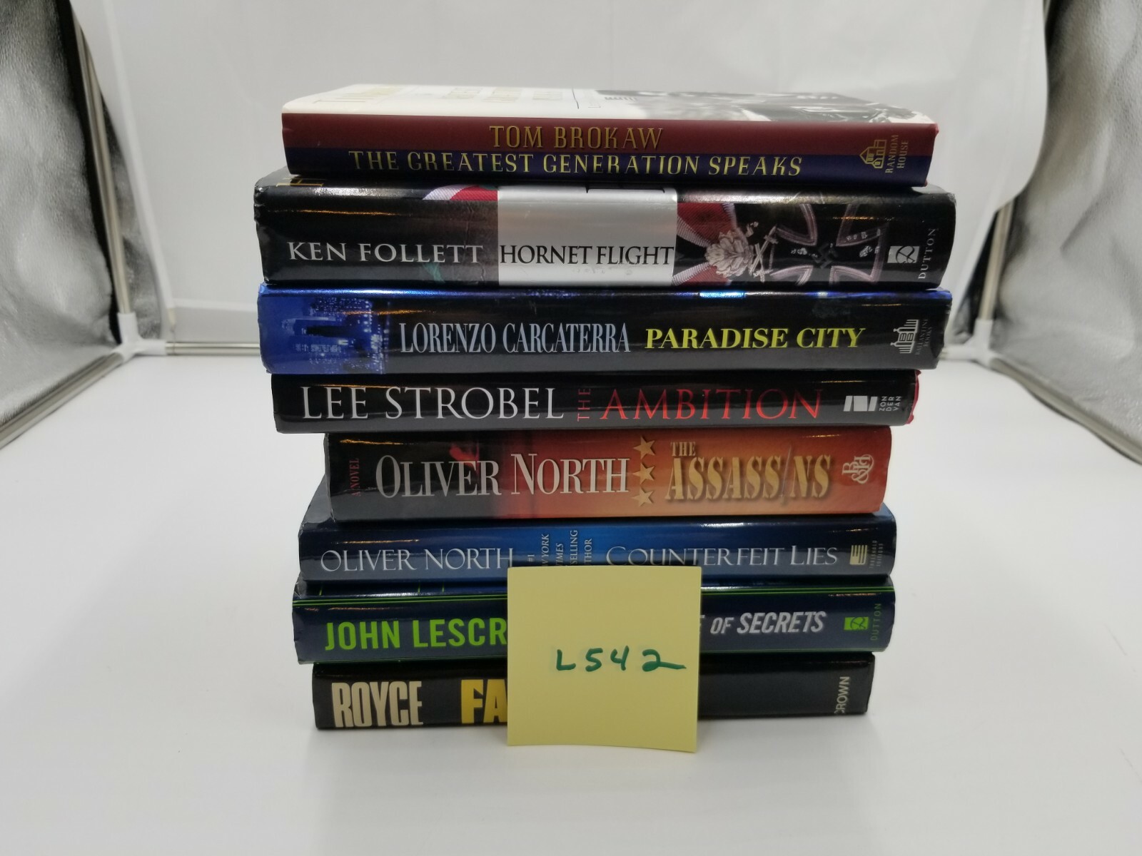Lot of 8 Books Oliver North Ken Follet & more. See pictures