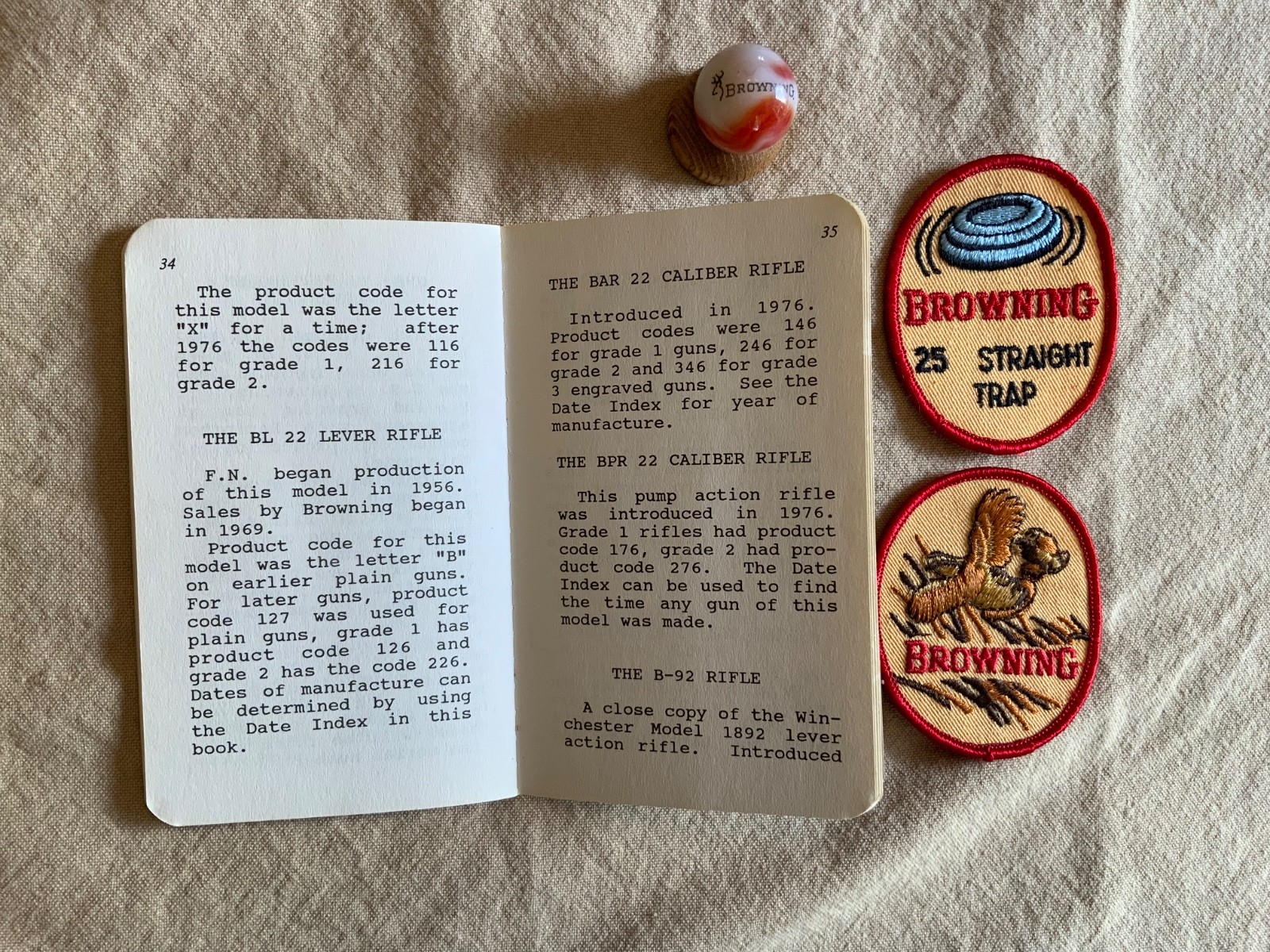 Browning Firearms collectibles -Browning signed book, 2 Patches, Marble&holder