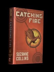 Book: CATCHING FIRE by Suzanne Collins HUNGER GAMES Book 2 HCDJ New
