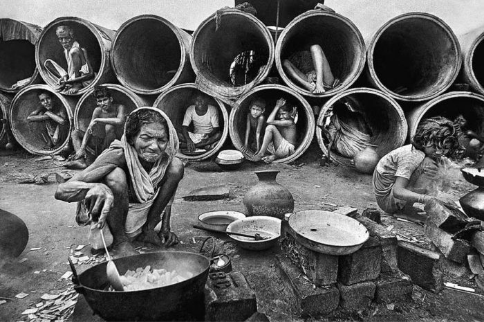 Archival scene of civilians displaced during the 1971 Bangladesh Liberation War amid widespread destruction.