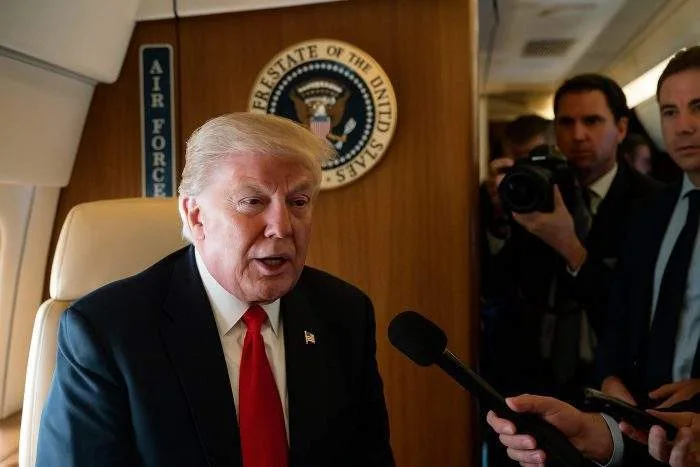 Donald Trump speaks to journalists aboard Air Force One during a press briefing. Donald Trump speaks to journalists aboard Air Force One during a press briefing.