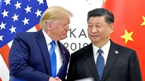 U.S. President Donald Trump and Chinese President Xi Jinping shaking hands during an official meeting in Seoul, with American and Chinese flags in the background.