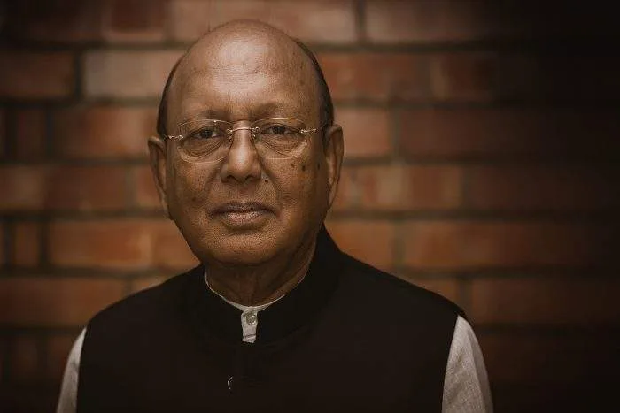Portrait of veteran Bangladeshi politician Tofail Ahmed in a dark tone, enhanced with a mourning atmosphere, horizontal format, no text.