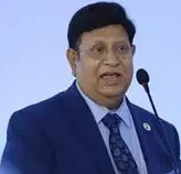 Dr. A. K. Abdul Momen speaks at an international conference podium.