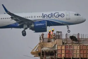 A horizontal, text-free image of an IndiGo aircraft on a runway, symbolizing flight disruptions in India’s aviation sector.