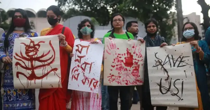 Members of Bangladesh’s Hindu community gather in mourning after a fatal attack.