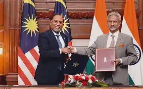 PM Narendra Modi and PM Anwar Ibrahim shaking hands at the Perdana Putra Complex in Putrajaya, Malaysia.